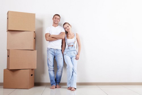 Moving boxes and furniture in a Colliers Wood removals setting