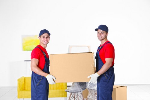 Office relocation planning in Colliers Wood with furniture and boxes prepared for transport