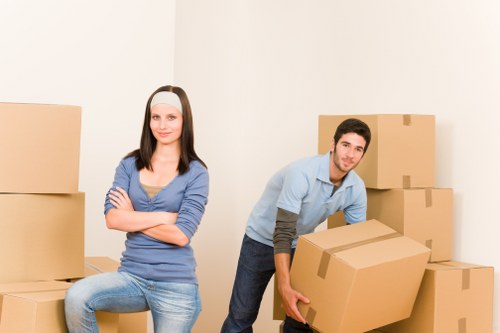 Team planning a business move with labelled boxes and workspace setup details