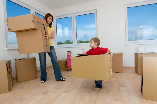 Moving boxes and furniture using removal truck hire in Colliers Wood