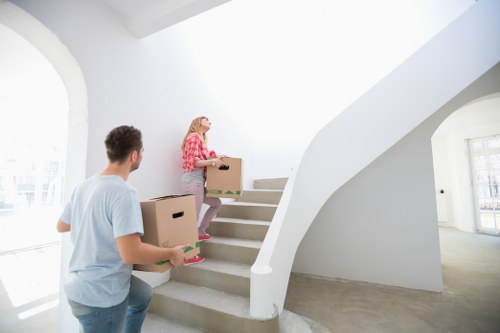 Professional movers transporting household items across Colliers Wood
