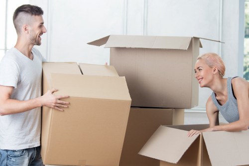 Careful handling of large furniture items during a local move