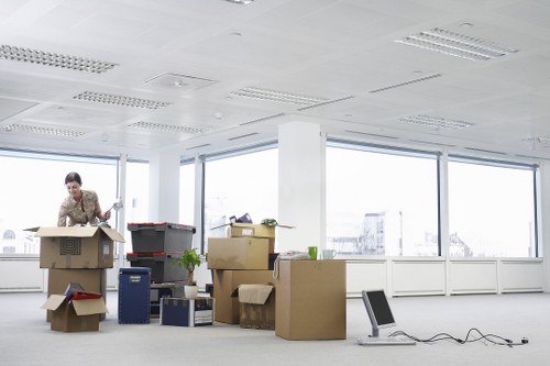 Professional movers loading household items for a Colliers Wood relocation