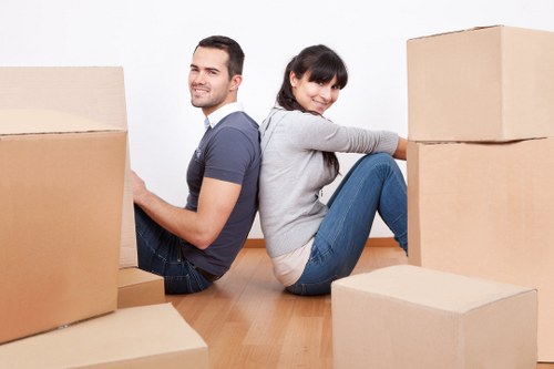 Preparing a home for moving day with labelled boxes and protected furniture