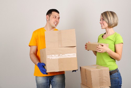 Assorted cardboard boxes and protective packing materials for local removals