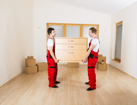 Careful loading of household items for transport in Colliers Wood
