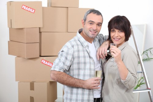 Movers handling boxes and furniture in a residential move